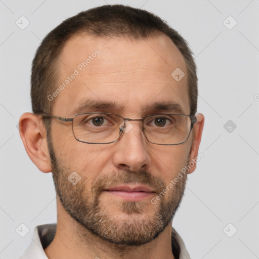 Joyful white adult male with short  brown hair and brown eyes