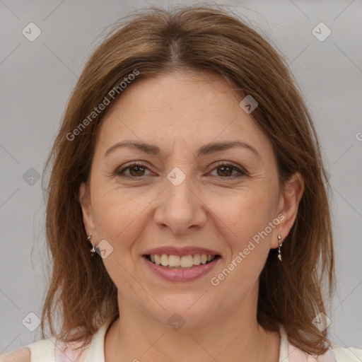 Joyful white adult female with medium  brown hair and brown eyes