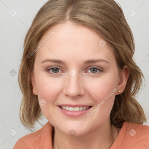 Joyful white young-adult female with medium  brown hair and blue eyes