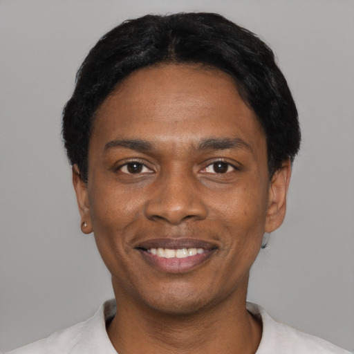 Joyful black young-adult male with short  black hair and brown eyes