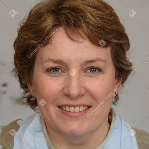 Joyful white adult female with medium  brown hair and blue eyes