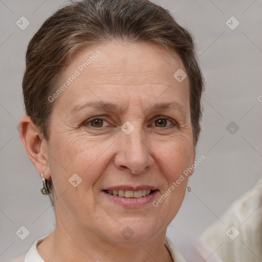 Joyful white adult female with short  brown hair and brown eyes