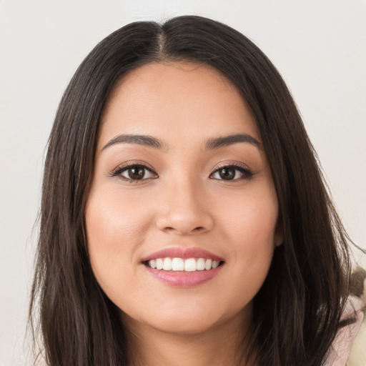 Joyful white young-adult female with long  brown hair and brown eyes