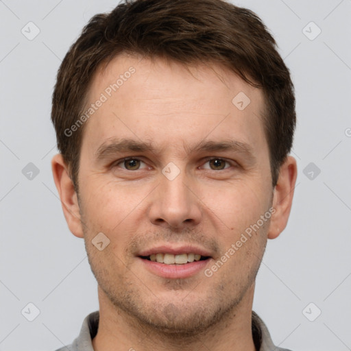 Joyful white adult male with short  brown hair and brown eyes