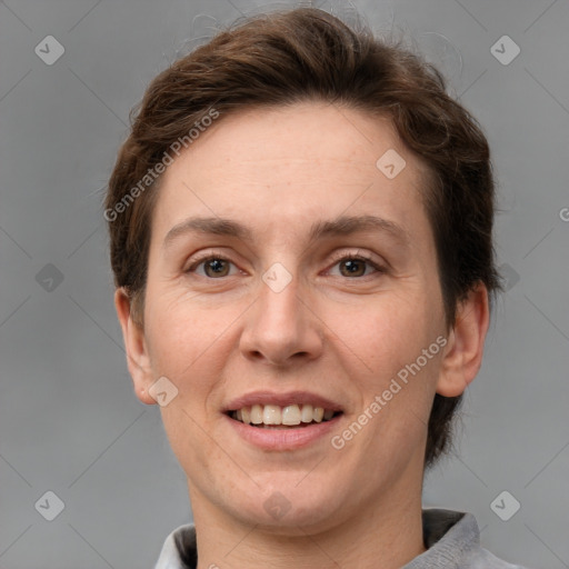 Joyful white adult female with short  brown hair and brown eyes