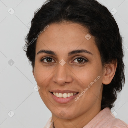 Joyful latino young-adult female with medium  brown hair and brown eyes