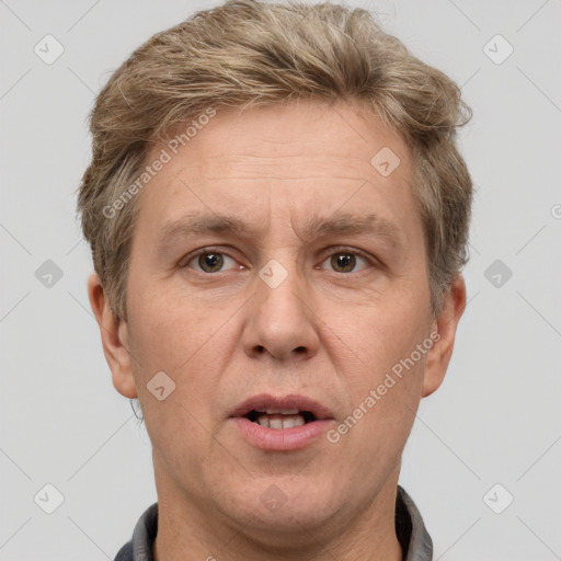 Joyful white adult male with short  brown hair and grey eyes