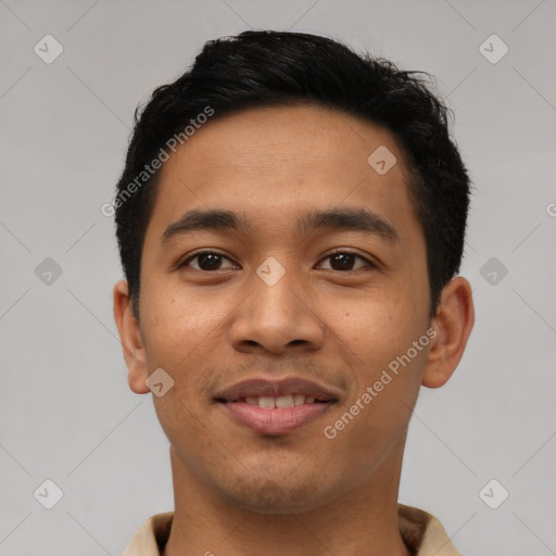 Joyful asian young-adult male with short  black hair and brown eyes