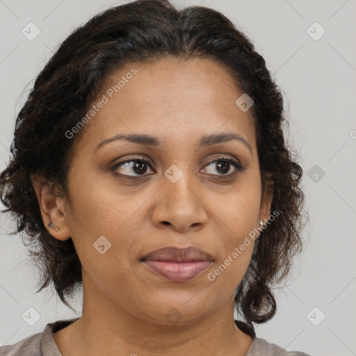 Joyful black adult female with medium  brown hair and brown eyes