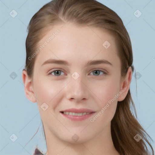 Joyful white young-adult female with long  brown hair and blue eyes