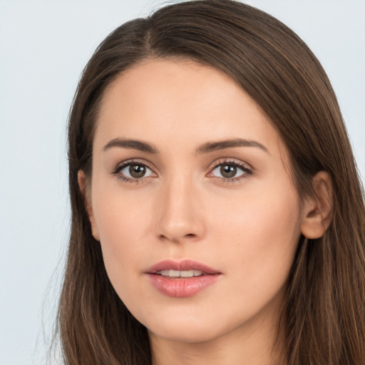 Neutral white young-adult female with long  brown hair and brown eyes