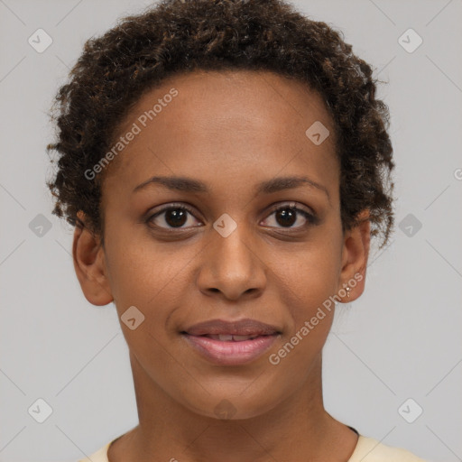 Joyful black young-adult female with short  brown hair and brown eyes