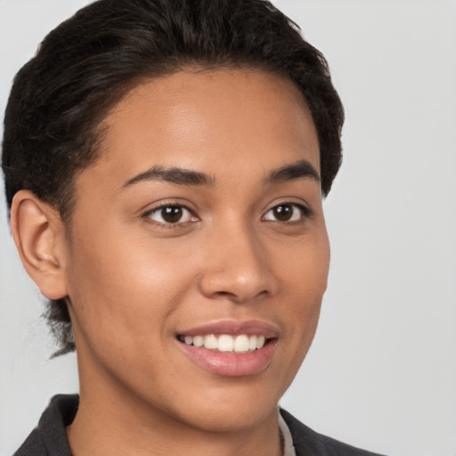 Joyful latino young-adult female with short  brown hair and brown eyes