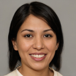 Joyful white young-adult female with medium  brown hair and brown eyes