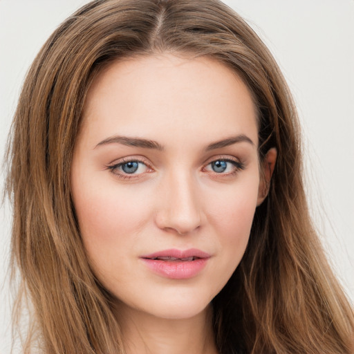 Joyful white young-adult female with long  brown hair and green eyes