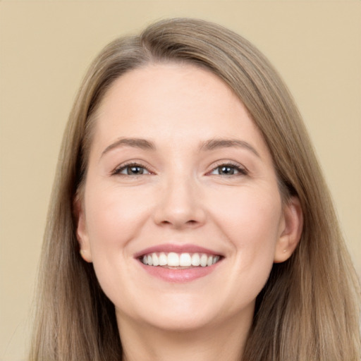 Joyful white young-adult female with long  brown hair and grey eyes