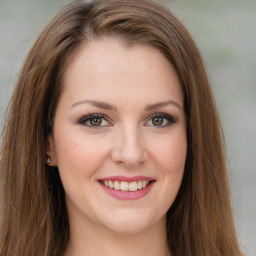 Joyful white young-adult female with long  brown hair and green eyes