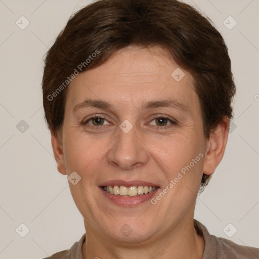 Joyful white adult female with short  brown hair and brown eyes