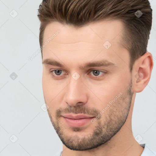 Joyful white young-adult male with short  brown hair and brown eyes