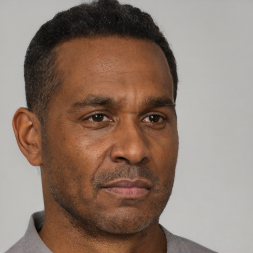 Neutral black adult male with short  brown hair and brown eyes