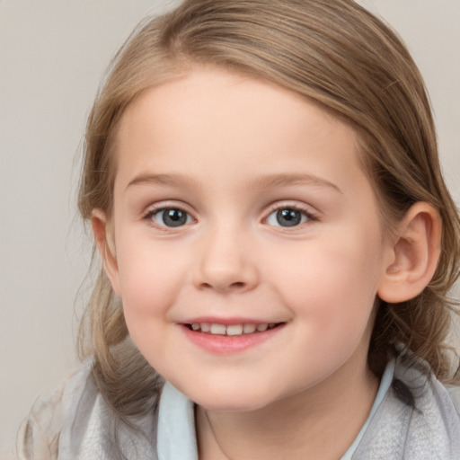 Joyful white child female with medium  brown hair and blue eyes