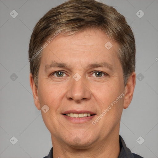 Joyful white adult male with short  brown hair and grey eyes