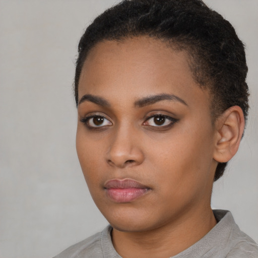 Neutral black young-adult female with short  black hair and brown eyes