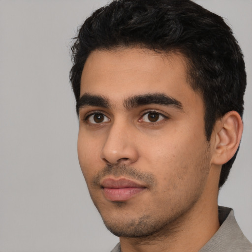 Neutral latino young-adult male with short  black hair and brown eyes