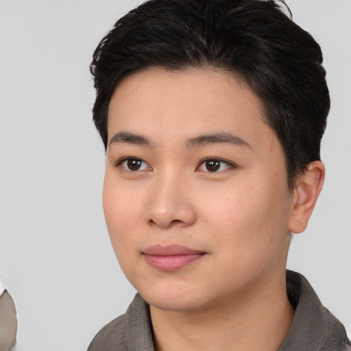Joyful white young-adult female with short  black hair and brown eyes