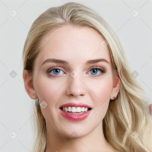 Joyful white young-adult female with long  brown hair and blue eyes