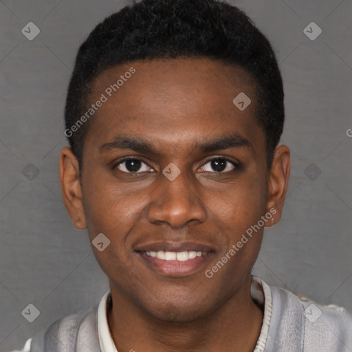 Joyful black young-adult male with short  black hair and brown eyes