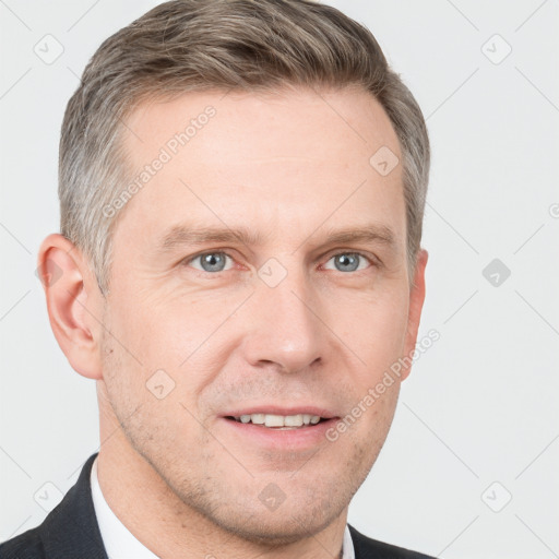 Joyful white adult male with short  brown hair and grey eyes