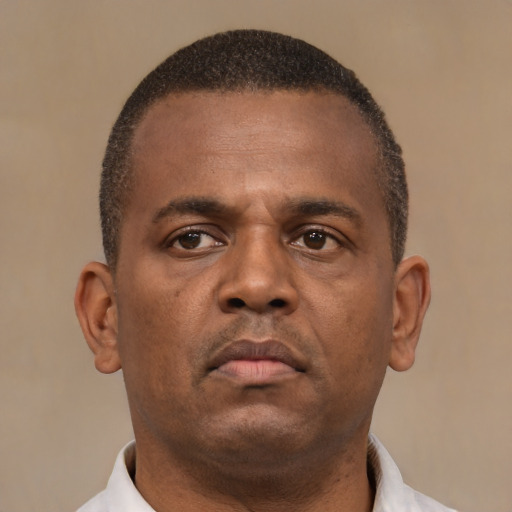 Neutral black young-adult male with short  brown hair and brown eyes
