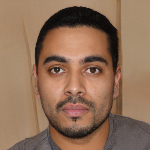 Neutral latino young-adult male with short  black hair and brown eyes