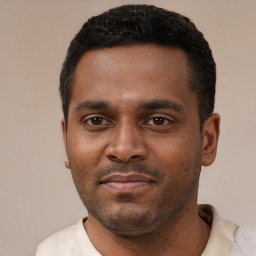 Neutral black young-adult male with short  black hair and brown eyes