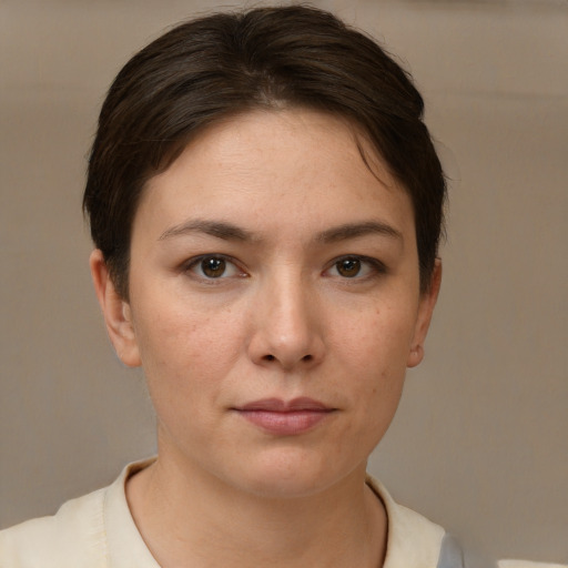 Neutral white young-adult female with short  brown hair and brown eyes