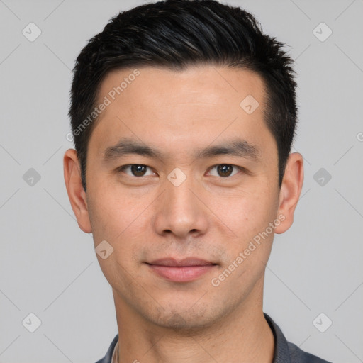 Joyful white young-adult male with short  black hair and brown eyes