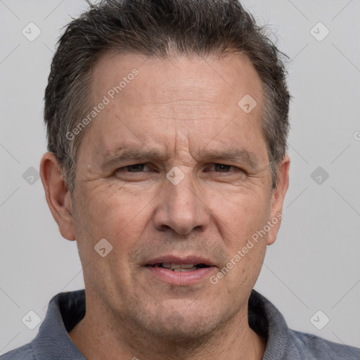 Joyful white middle-aged male with short  brown hair and brown eyes