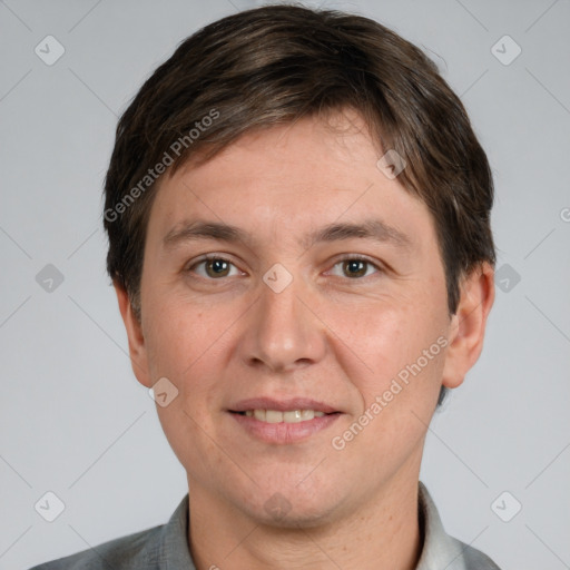 Joyful white adult male with short  brown hair and grey eyes