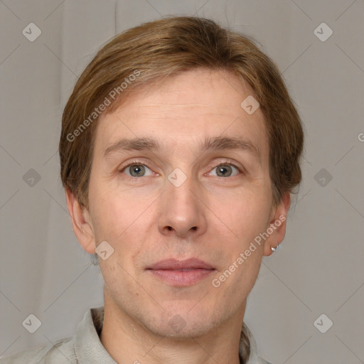 Joyful white adult male with short  brown hair and grey eyes