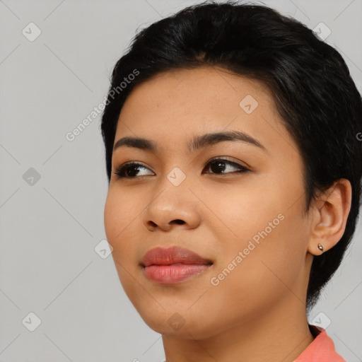 Joyful asian young-adult female with medium  black hair and brown eyes