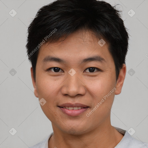 Joyful asian young-adult male with short  brown hair and brown eyes