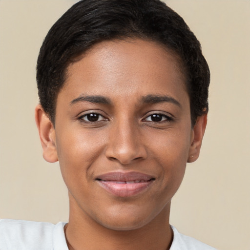 Joyful black young-adult female with short  brown hair and brown eyes