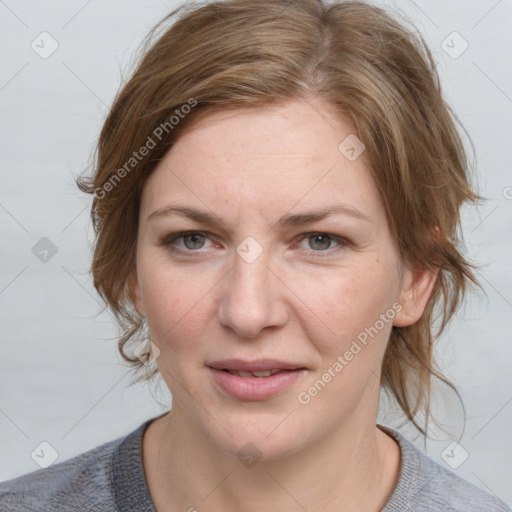 Joyful white young-adult female with medium  brown hair and blue eyes