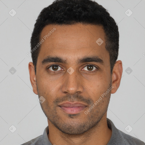 Joyful black young-adult male with short  black hair and brown eyes