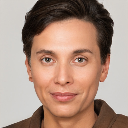 Joyful white adult male with short  brown hair and brown eyes