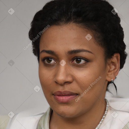 Joyful black young-adult female with short  black hair and brown eyes