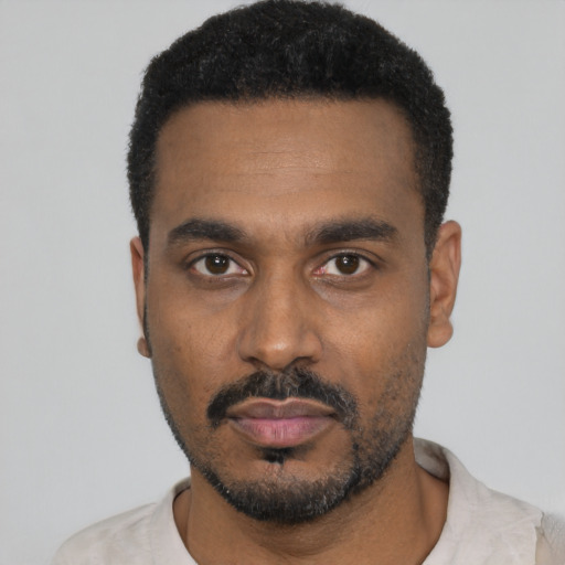 Neutral black young-adult male with short  black hair and brown eyes