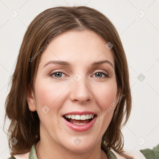 Joyful white young-adult female with medium  brown hair and green eyes