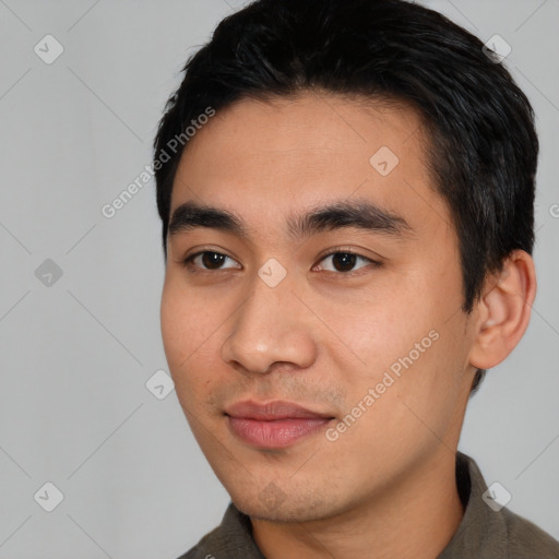 Joyful asian young-adult male with short  black hair and brown eyes